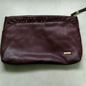 Wine colored bag eith wrist strap